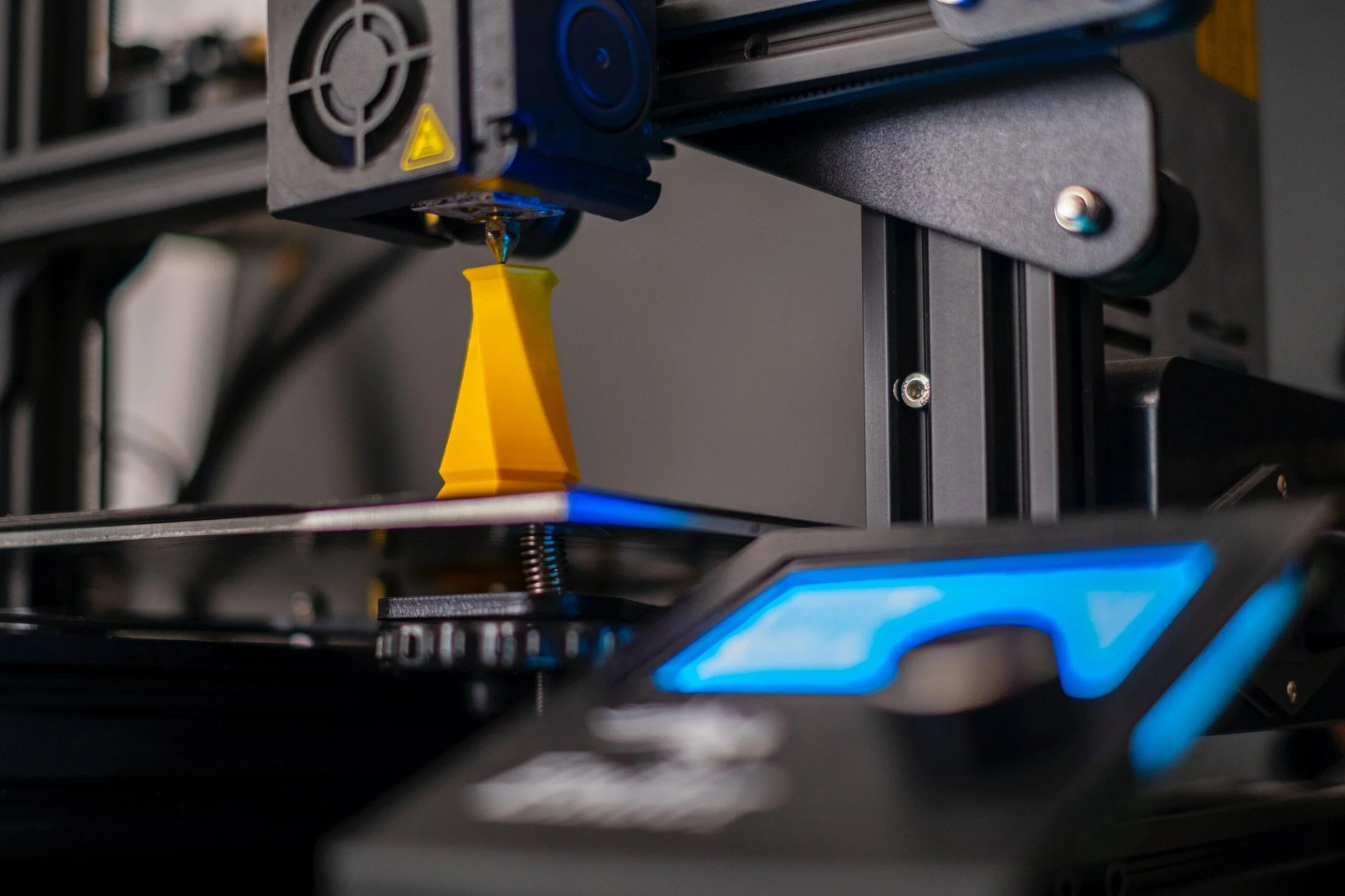 Close-up of additive manufacturing metal printer representing DiManEx 3D printing operations
